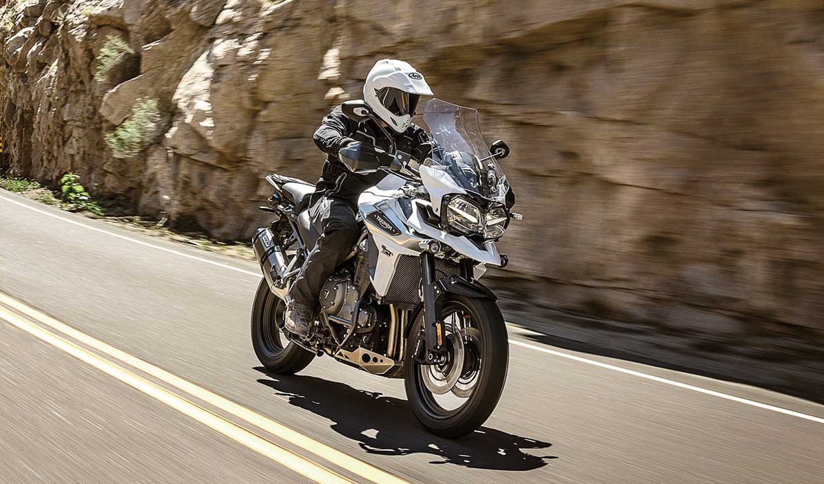 Triumph Tiger 1200 on the move, knobbly-friendly stance.